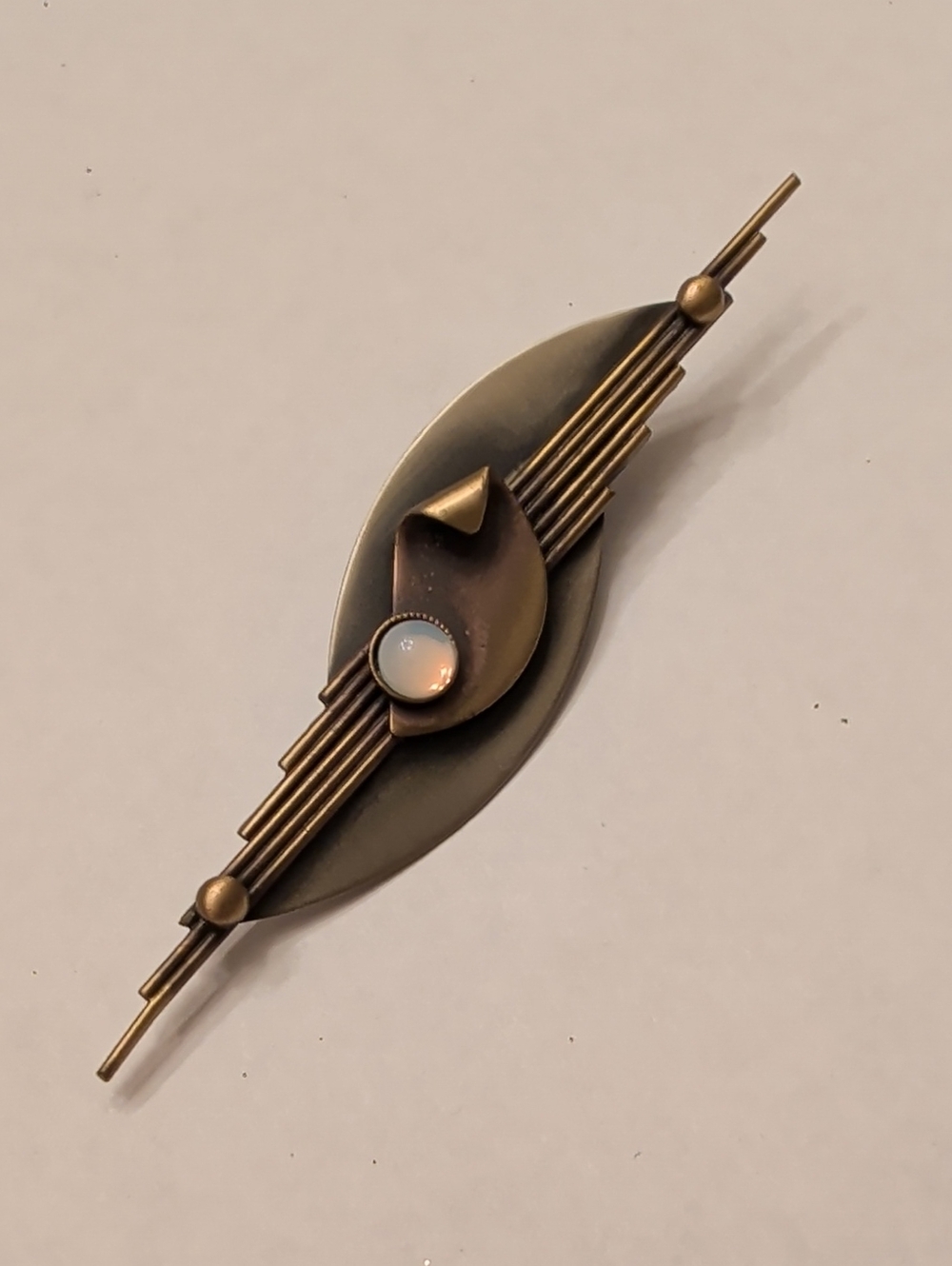 Vintage-Inspired Bronze Bar Brooch with Opalescent Cabochon